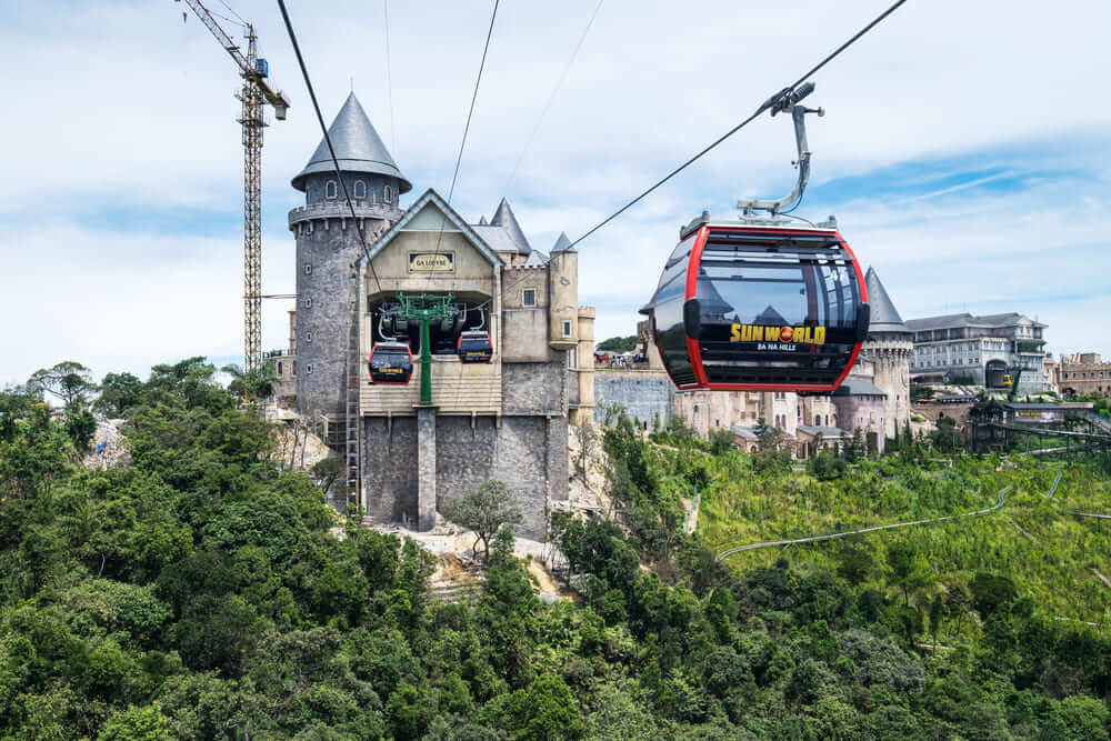 Cable car over Ba Na Hills with forest and castle view